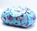 Detailed view of the cute blue unicorn print on a portable lazy drawstring makeup bag - Heart Unicorn