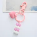 Close-up view of a cute pink heart and pastel building block keychain pendant charm - Single OPP Bag Packaging / Pink building block love buckle