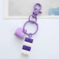 Macro view of a purple heart and building block keychain featuring a purple metal clasp. - Single OPP Bag Packaging / Purple building block love buckle