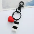 Detailed macro view of building block charm and red heart on creative black keychain - Single OPP Bag Packaging / Black love building block buckle