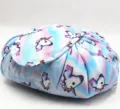 Detail of unicorn tie-dye drawstring makeup bag showing fabric and pattern - Light Blue Unicorn
