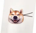 Macro detail of a 3D printed Shiba Inu dog face plush coin purse with a secure zipper closure - Laughing Shiba Inu