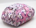 Detailed macro view of pink unicorn print drawstring lazy makeup bag with large storage capacity - Pink Unicorn