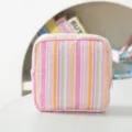 Portable pink and orange striped seersucker storage pouch for menstrual pads SKU - Pink Striped