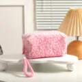 Macro view of pink leopard print plush makeup bag with soft texture and wristlet. - Pink (with Lanyard)