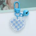 Detail view of blue checkerboard acrylic heart keychain with bell and lobster clasp - Blue Plaid Heart