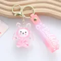 Close-up view of pink acrylic bunny keychain with sparkling liquid shaker detail - Pink Liquid Rabbit Style