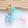 Sparkling flower shaped liquid shaker keychain with pastel gradient silicone strap charm - Plum Blossom Style / Blue