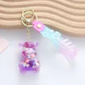 Detailed view of creative purple bear quicksand keychain with colorful beads inside - Jelly Bean Bear Style / Purple