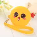 Petit porte-monnaie rond en silicone jaune avec visage de dessin animé et sangle. - 1团子 / Jaune