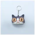 Adorable llavero de peluche con cabeza de gato impresa en 3D y aro metálico resistente. - Gato Curioso