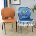 Detailed view of Italian style dining chair cover, quilted blue fabric with elegant lace trim. - Blue