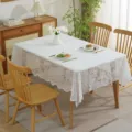 Detailed view of white lace tablecloth with floral embroidery in a home setting - 145*50CM / Phoenix Tail Pattern White