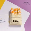 Close-up detail of the 3d resin French baguette bread fridge magnet showing fine texture. - Bread in Cloth Bag