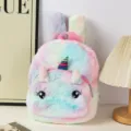 Close-up of cute plush unicorn backpack with colorful tie-dye fur and big eyes - Pink