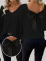 Dettaglio dell'elegante fiocco in raso sulla schiena di questo maglione nero con scollo a V. - Taglia S / Top / Nero