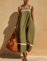 Dettaglio di un abito lungo senza maniche in lino verde con inserti a righe bianche - Taglia S / Verde militare