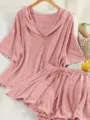 Close-up detail of the pink hooded short sleeve top and matching skort set for summer - 1XL / Set / Pink