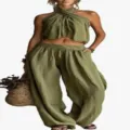 Detailed view of women's olive green two-piece set featuring halter neck top and wide-leg trousers - Army Green