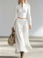 Elegante set con top bianco a maniche lunghe con zip e gonna lunga a pieghe fluida - Taglia S / Bianco