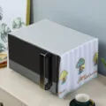 Quilted microwave dust cover with colorful embroidered mushroom design detail shot - Mushroom Green