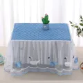 Close-up of white lace microwave cover with blue quilted top and embroidered swan motifs - Universal Microwave Cover (35x50x25cm) / Swan Blue Microwave Cover
