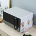Detailed view of the embroidered mushroom pattern on the white lace microwave dust cover - Mushroom Pink