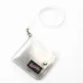 Detailed macro view of the transparent silver glitter PVC wallet featuring the Dongjin label - Clear