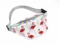 Stylish transparent PVC fanny pack featuring red flamingo patterns and a holographic zipper trim - Flamingo-1