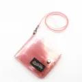 Close-up of pink glittery transparent PVC neck strap wallet with snap closure detail - Pink