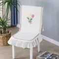 White quilted chair cover with tulip embroidery and ruffled edge for dining chairs. - One Size / Tulip One-piece Beige