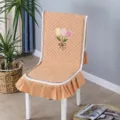 Orange quilted chair cover with tulip embroidery and ruffled skirt for dining chairs - One Size / Tulip Integrated Orange
