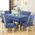 Detailed view of quilted blue tablecloth and matching chair covers in a dining room - 1 Chair Cover / Flax Blue