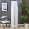 Elegant white lace cylindrical vertical air conditioner dust cover in home setting - Stay-on AC Cover - Candy White
