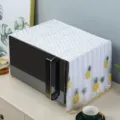 Detailed view of white lace microwave dust cover with embroidered pineapple pattern - Pineapple