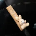 Close-up of plush bunny car seat belt cover featuring soft teddy fleece texture and embroidery - Yellow Bunny