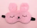Front view of cute pink plush rabbit sleep mask with embroidered closed eyes and nose - Squinty Eye Rabbit / Pink