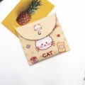 Close-up of a cute cream-colored storage pouch with a cartoon cat design and metal snap - Yellow