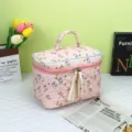Detailed view of pink quilted cosmetic bag featuring cute bunny prints and elegant ribbon zippers - 23*16*16cm / Large Pink Rabbit