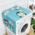 Cartoon penguin washing machine dust cover with side storage pockets and blue landscape design. - Animal Party