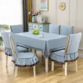 Elegant light blue fabric dining set featuring a tablecloth and ruffled chair covers. - 1 Chair Cover / Linen Light Blue