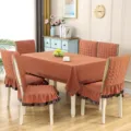 Elegant terracotta quilted dining tablecloth set with matching ruffled chair covers for home decor - Linen Orange
