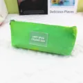 Detailed view of the vibrant green tie-dye pencil case with a clear decorative patch. - Green