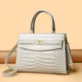 Vintage crocodile embossed handbag with gold lock and adjustable crossbody shoulder strap - Light Gray