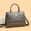 Elegant grey crocodile embossed tote bag with gold flower lock and crossbody strap - Dark Gray