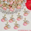 Close-up of pink shell and starfish charms with pearls for DIY jewelry making. - Pink
