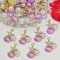 Macro view of purple enamel seashell and pearl charms for elegant DIY jewelry crafts - Purple