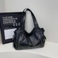 Large black vintage faux leather tote bag with functional silver zipper details for travel - Black