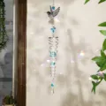 Atrapasol de cristal de colibrí con hermosos y brillantes reflejos de arco iris - Colibrí azul claro