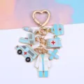 Medical themed zinc alloy keychain with ambulance, doctor coat and syringe charms - Blue